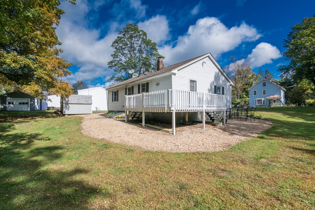 82 Comins Pond Road Warren, MA 01083 - Photo 14 of 18 a view of a house with a yard