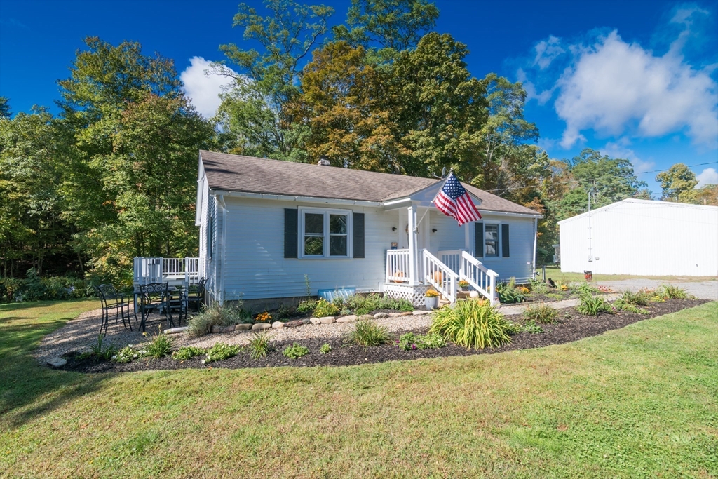 82 Comins Pond Road Warren, MA 01083 - Photo 17 of 18 a view of a house with a yard