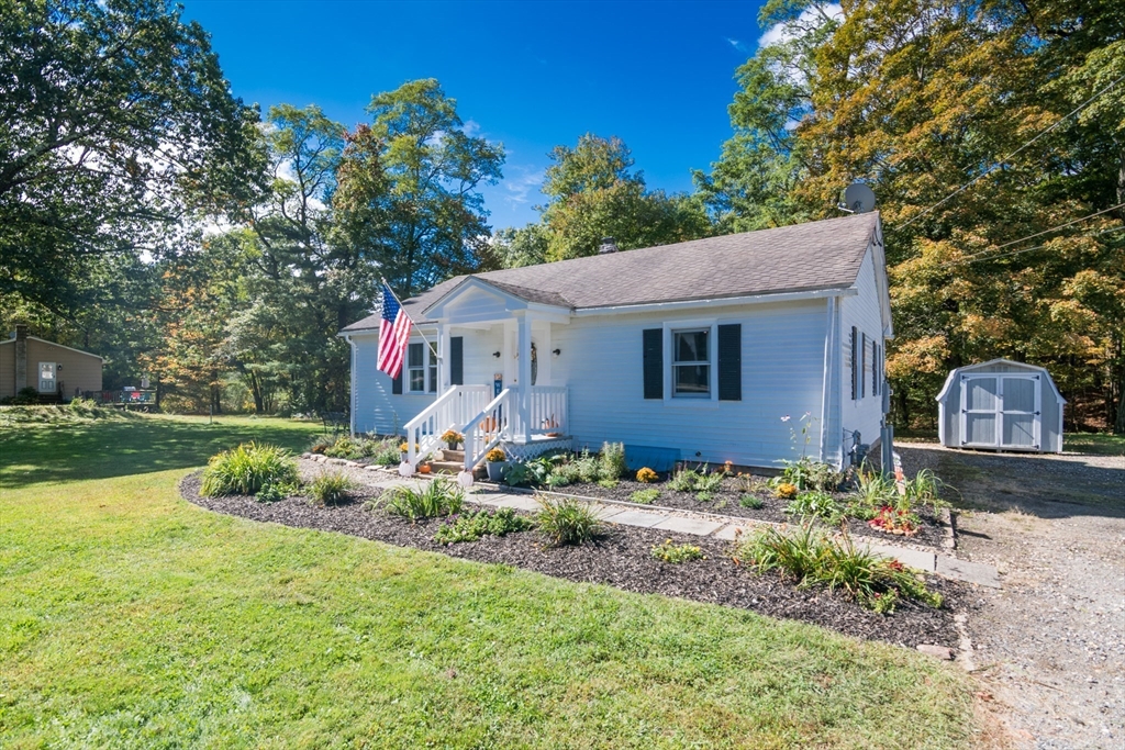 82 Comins Pond Road Warren, MA 01083 - Photo 18 of 18 a front view of a house with garden