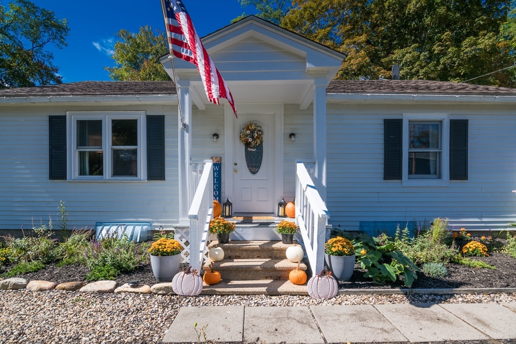 82 Comins Pond Road Warren, MA 01083 - Photo 2 of 18 a front view of a house with patio