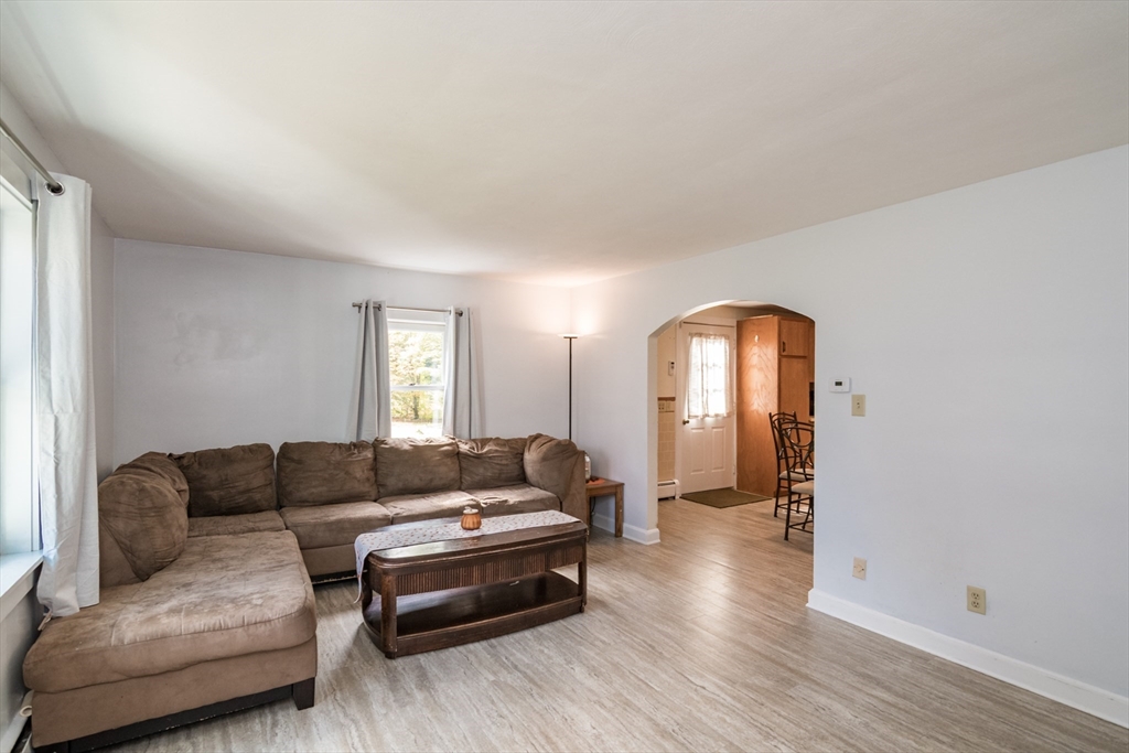 82 Comins Pond Road Warren, MA 01083 - Photo 4 of 18 a living room with furniture and wooden floor