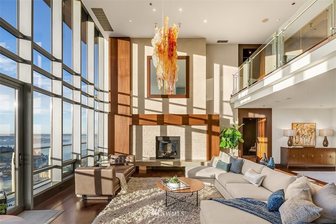 650 Bellevue Way Northeast, Unit 4102 Bellevue, WA 98004 - Photo 4 of 25 a living room with furniture fireplace and large windows