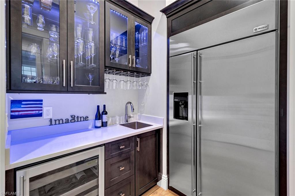 709 Teal Court Naples, FL 34108 - Photo 20 of 39 a bathroom with a sink and a mirror