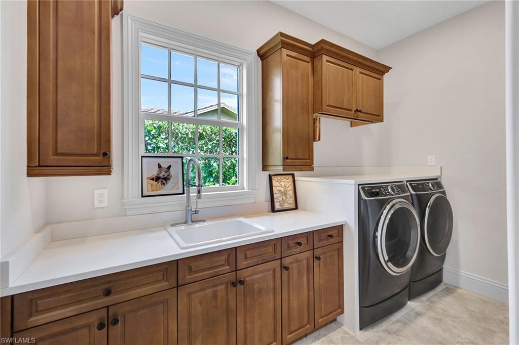709 Teal Court Naples, FL 34108 - Photo 21 of 39 a utility room with sink dryer and washer
