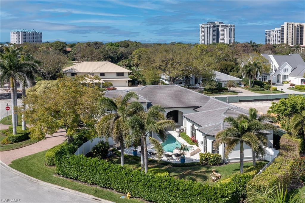709 Teal Court Naples, FL 34108 - Photo 36 of 39 an aerial view of multiple houses with yard