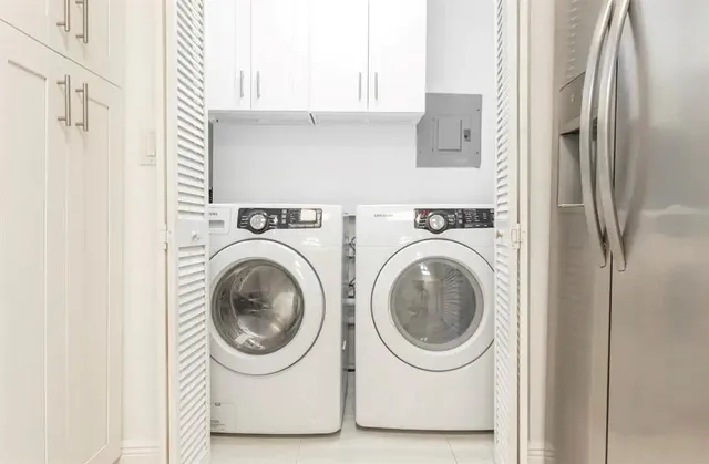 a utility room with dryer and washer