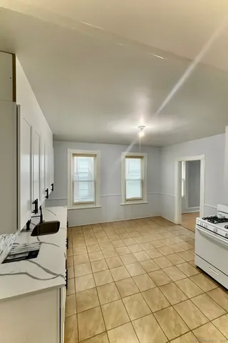 a view of a livingroom with furniture and windows