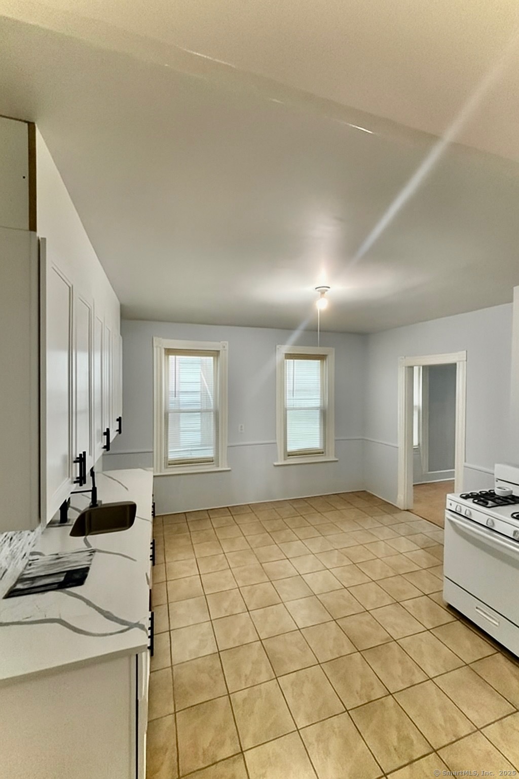 a view of a livingroom with furniture and windows