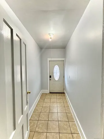 a view of a hallway with a window