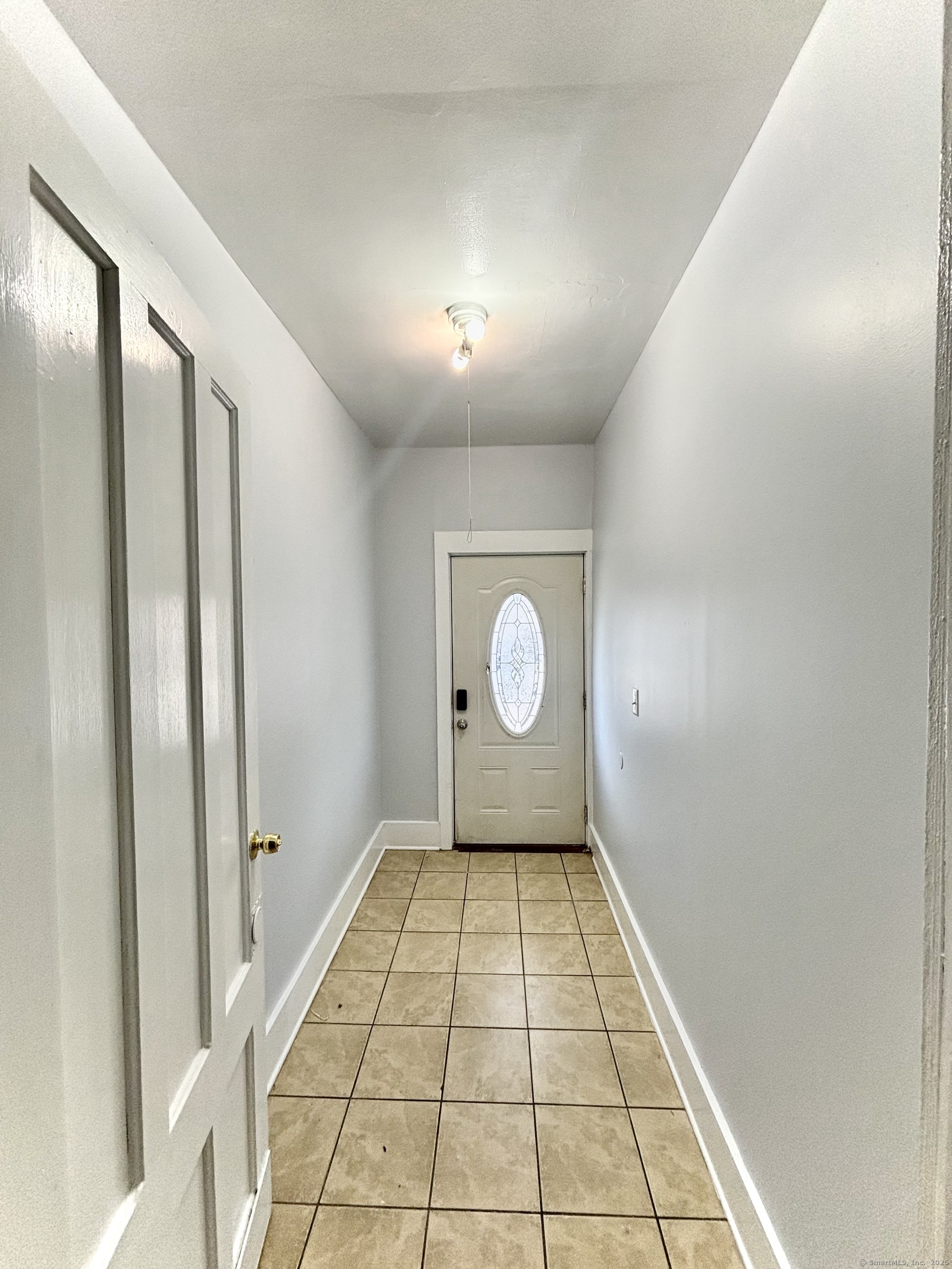 57 Houston Street, Unit 1 New Haven, CT 06513 - Photo 11 of 11 a view of a hallway with a window