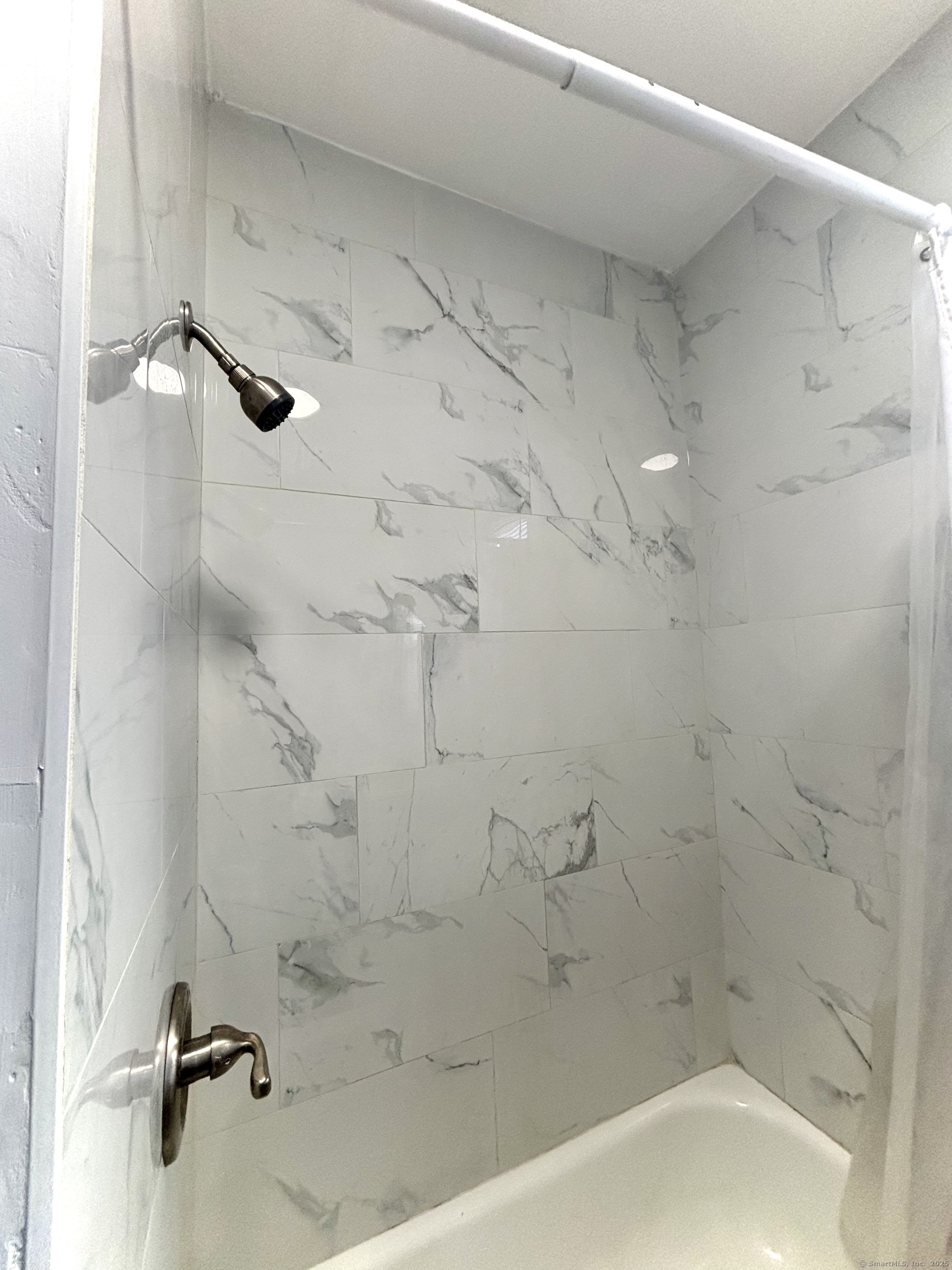 57 Houston Street, Unit 1 New Haven, CT 06513 - Photo 2 of 11 a bath tub sitting next to a white sink