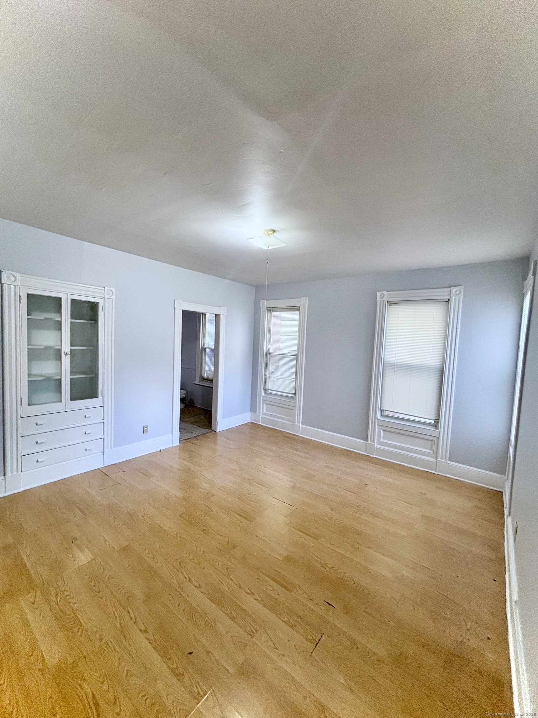 57 Houston Street, Unit 1 New Haven, CT 06513 - Photo 4 of 11 a view of empty room with windows