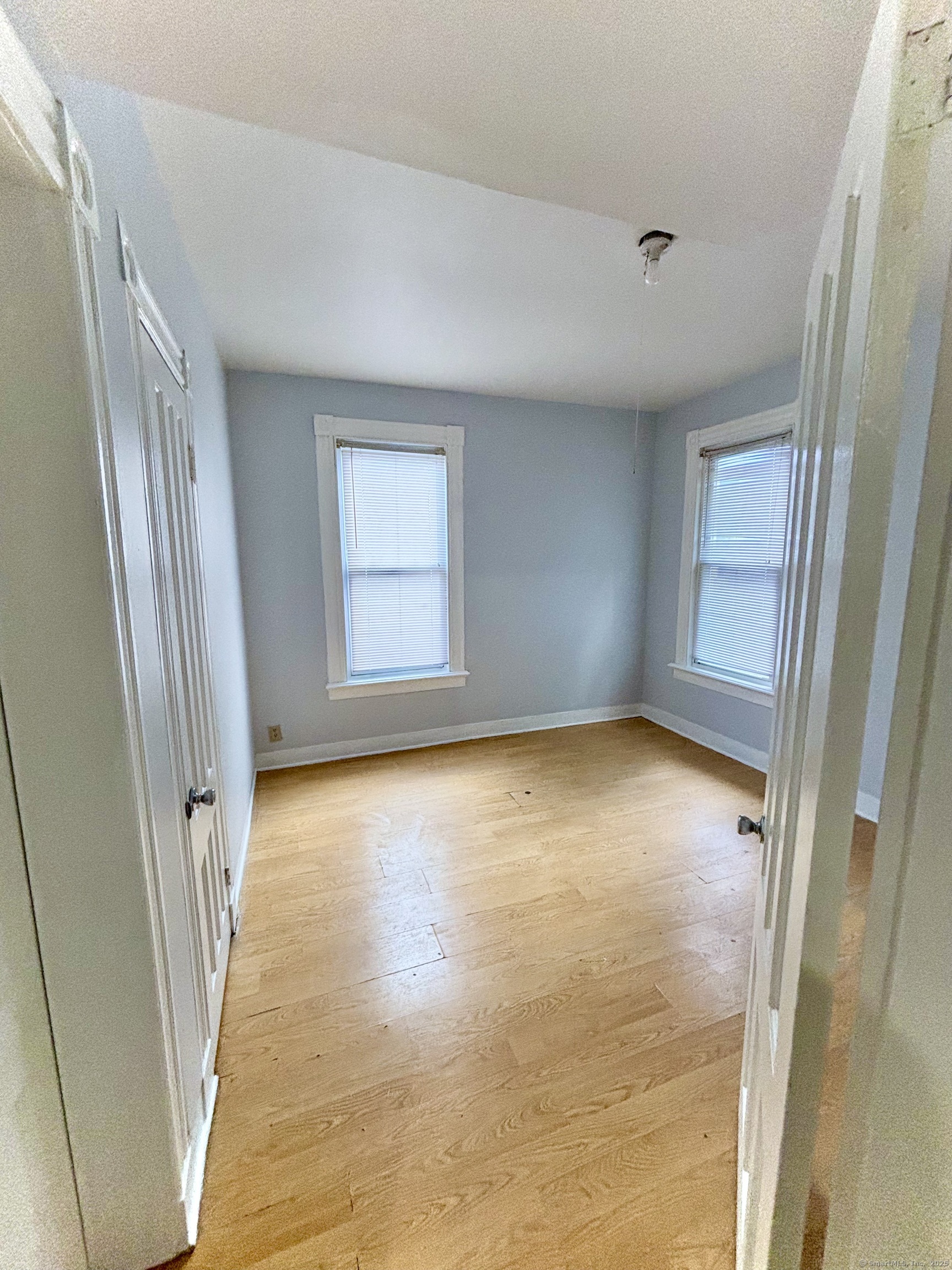 57 Houston Street, Unit 1 New Haven, CT 06513 - Photo 6 of 11 an empty room with windows