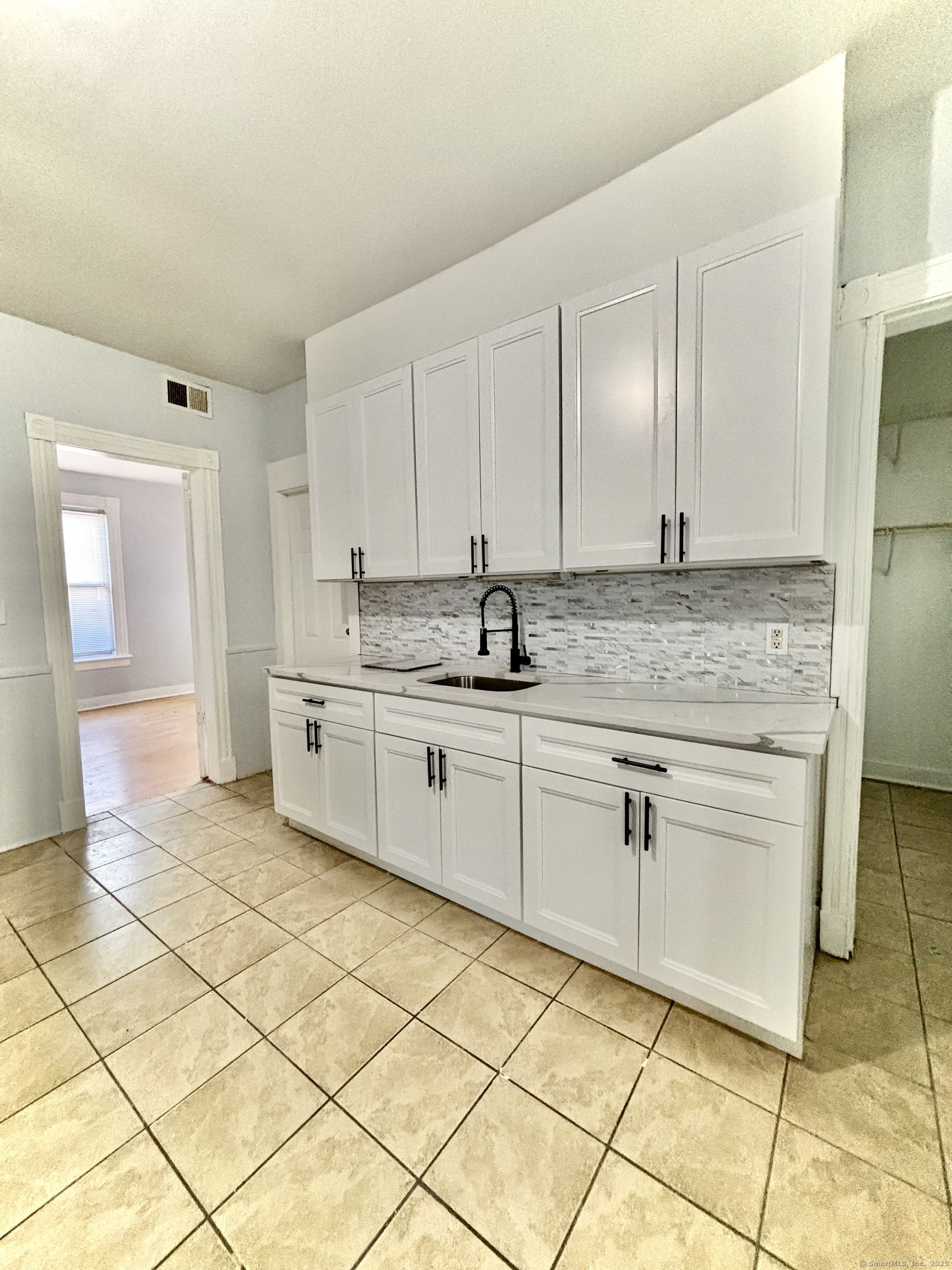 57 Houston Street, Unit 1 New Haven, CT 06513 - Photo 8 of 11 a kitchen with a sink cabinets and window