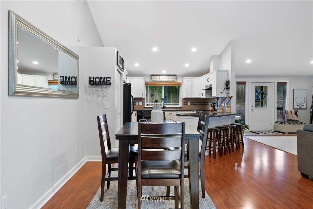 14817 South Tilley Road Tenino, WA 98589 - Photo 16 of 38 a dining room with furniture and wooden floor