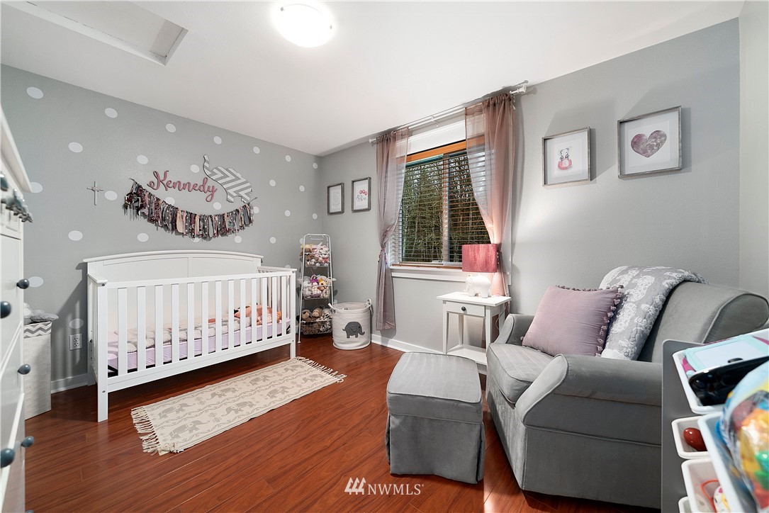 14817 South Tilley Road Tenino, WA 98589 - Photo 21 of 38 a bedroom with furniture and a large window