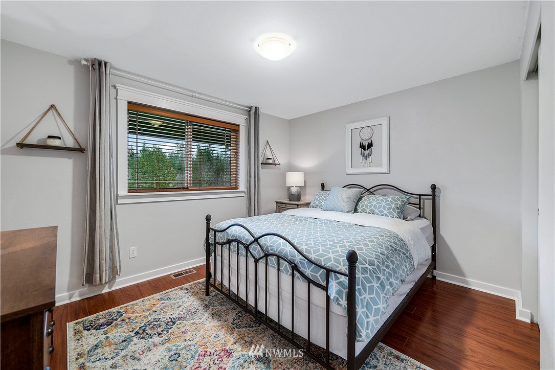 14817 South Tilley Road Tenino, WA 98589 - Photo 23 of 38 a bedroom with a bed and a window