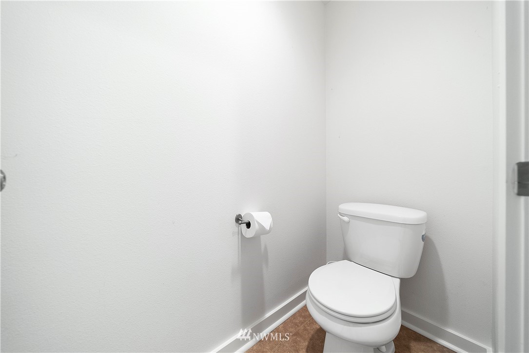 14817 South Tilley Road Tenino, WA 98589 - Photo 25 of 38 a white toilet sitting next to a white wall