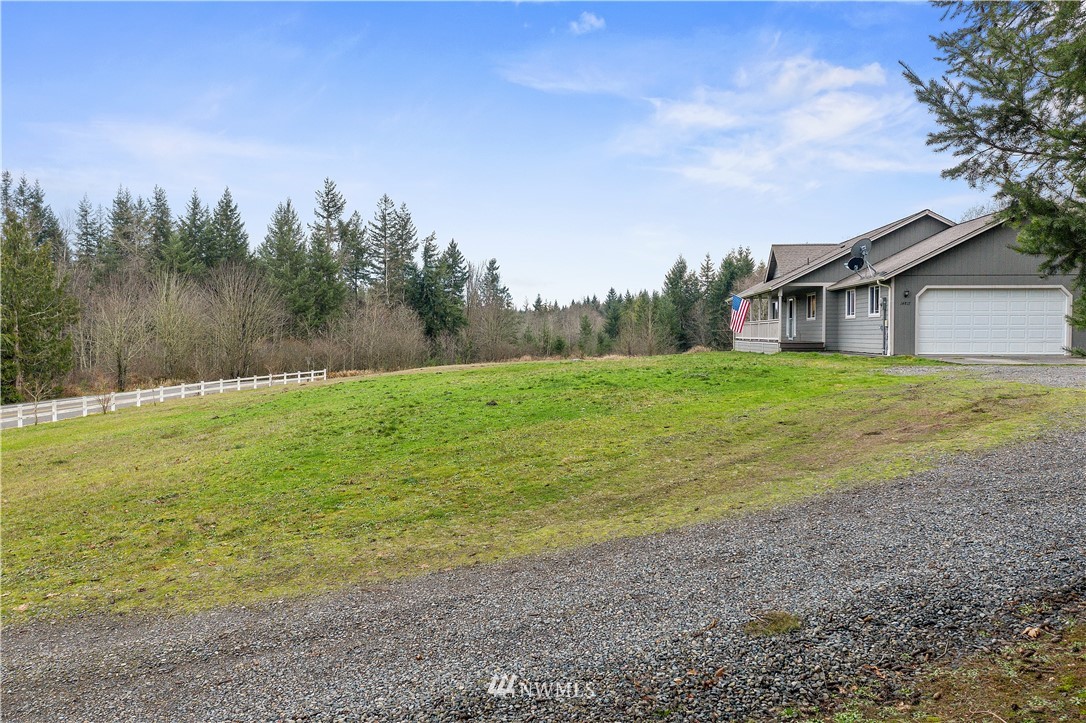 14817 South Tilley Road Tenino, WA 98589 - Photo 37 of 38 a view of a yard with a house in the background