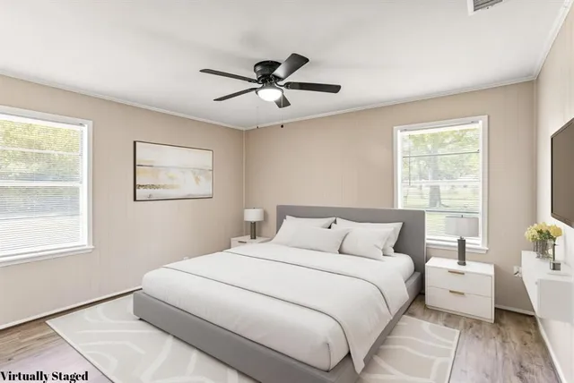 a bedroom with a large bed and a window