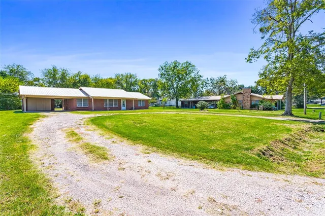 a view of a house with a big yard