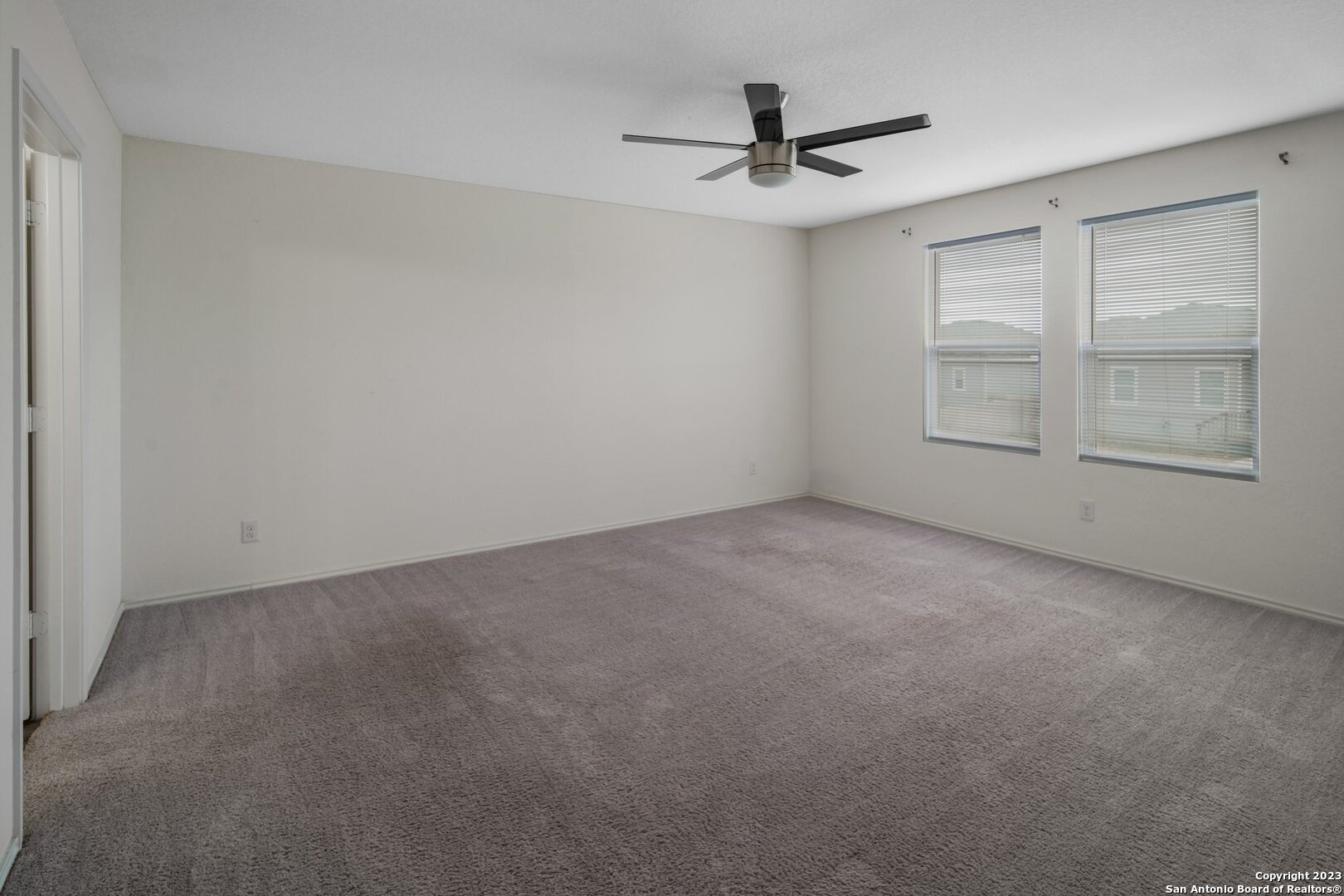 5246 Winding Streme St. Hedwig, TX 78152 - Photo 14 of 25 a view of an empty room with a window