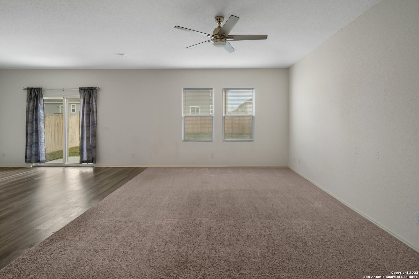 5246 Winding Streme St. Hedwig, TX 78152 - Photo 2 of 25 a view of an empty room with a window