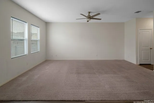 a view of an empty room with a window