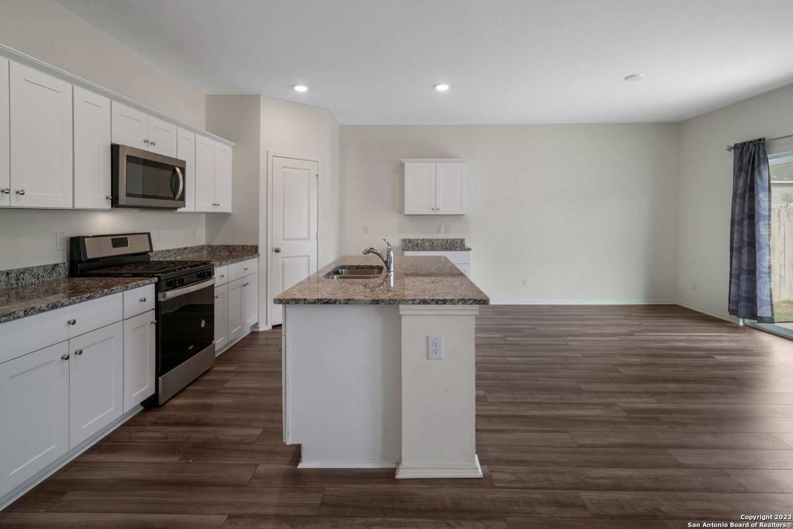 5246 Winding Streme St. Hedwig, TX 78152 - Photo 6 of 25 a kitchen with a sink and cabinets