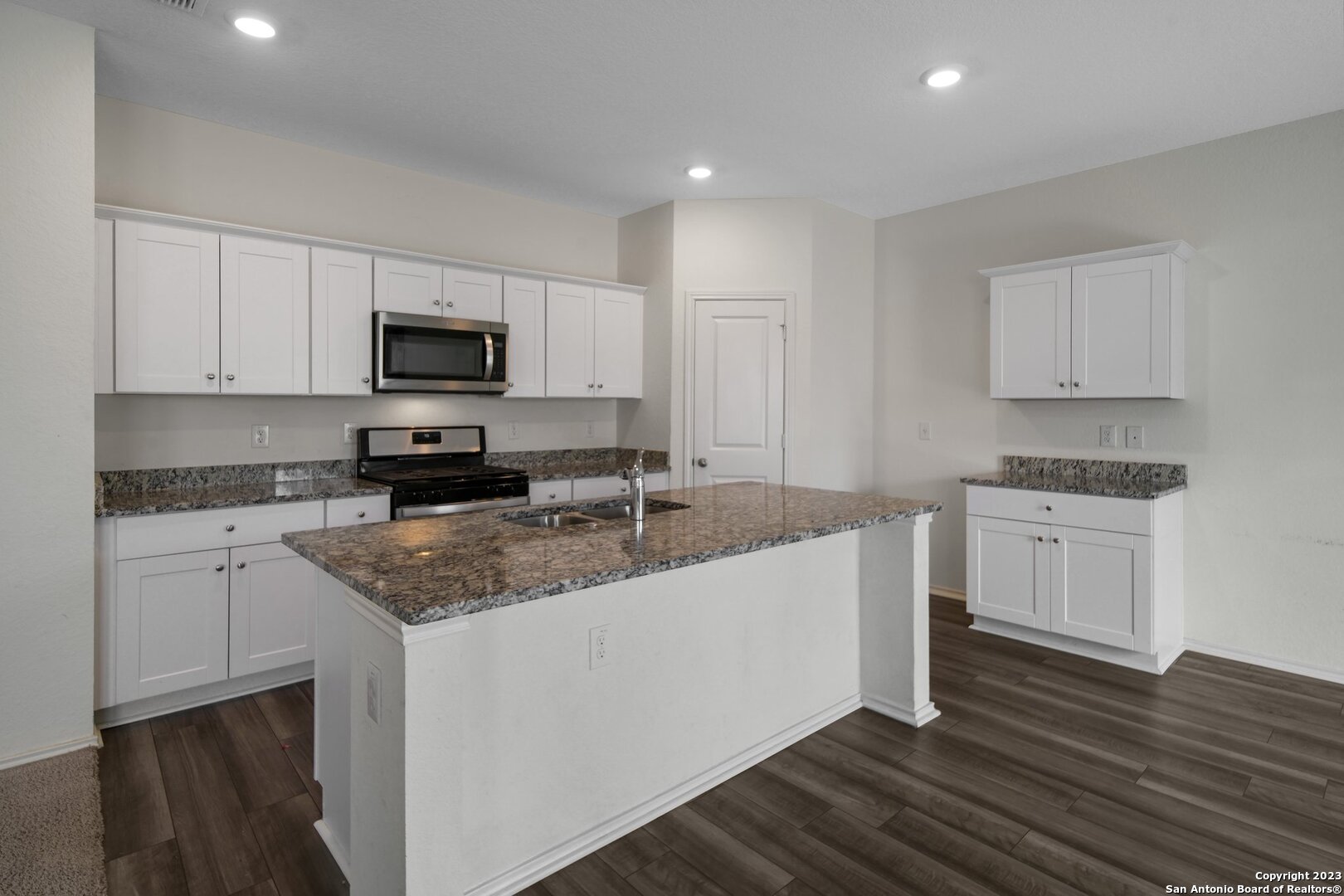 5246 Winding Streme St. Hedwig, TX 78152 - Photo 7 of 25 a kitchen with appliances a sink and cabinets