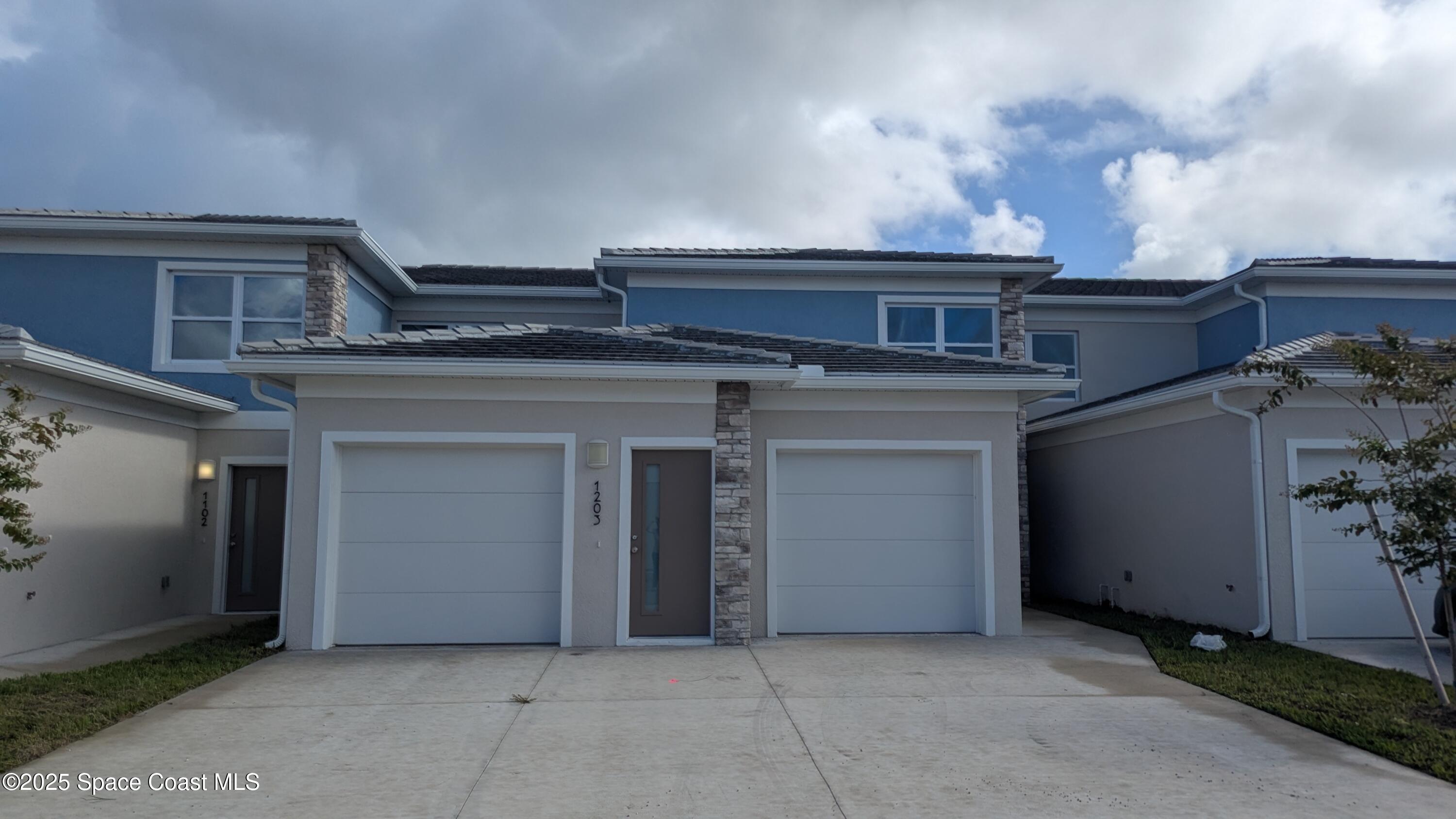 a view of a house with garage