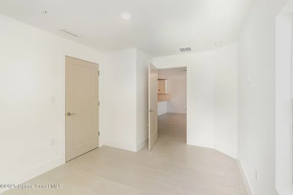 a view of a room with a hallway