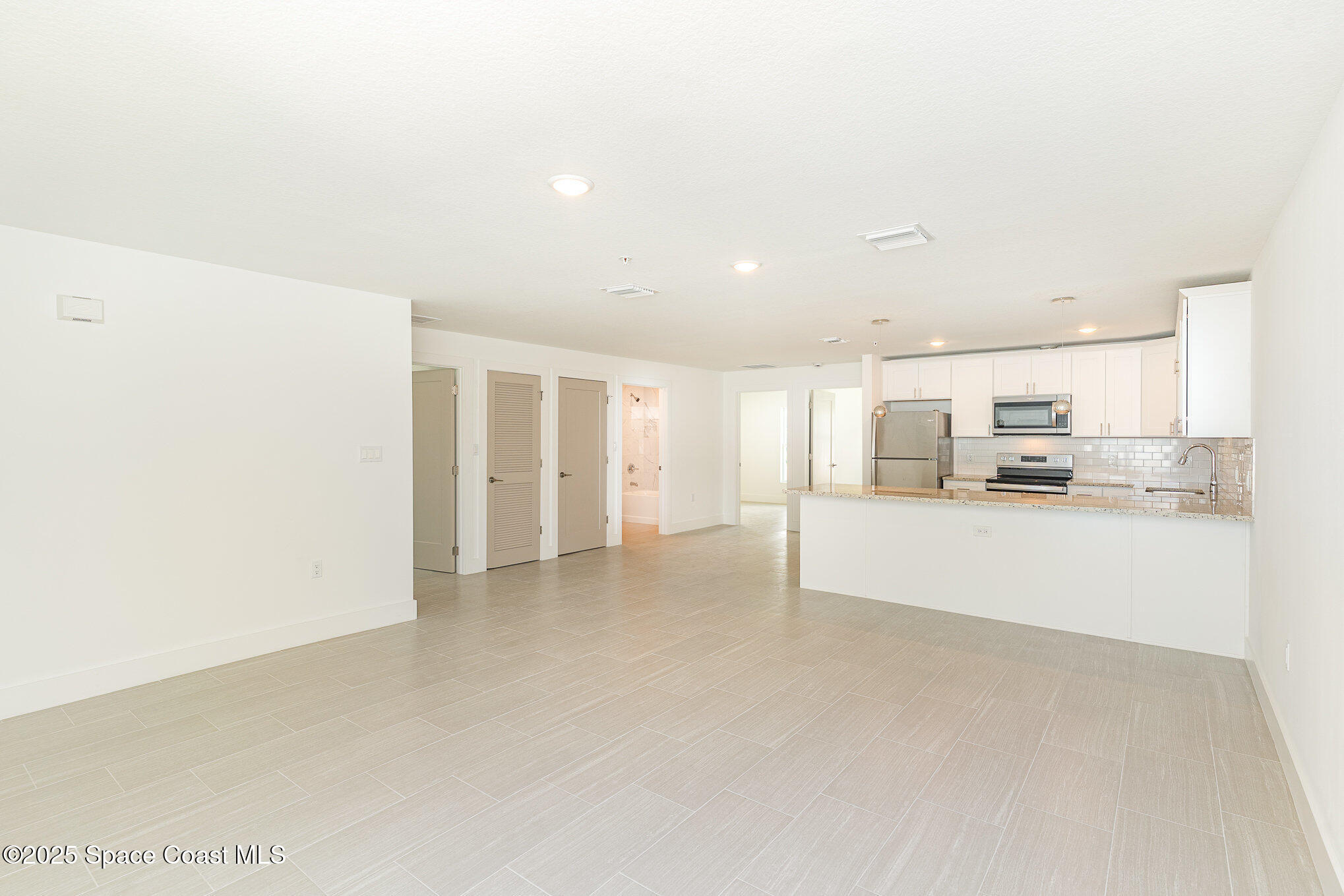 1625 Par Street, Unit 1203 Palm Bay, FL 32905 - Photo 7 of 38 a view of kitchen and refrigerator
