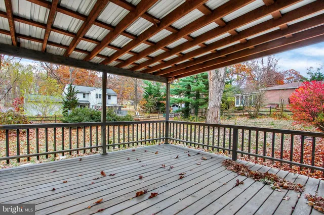 a view of balcony with wooden floor