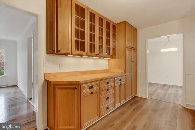 a view of an entryway with wooden floor