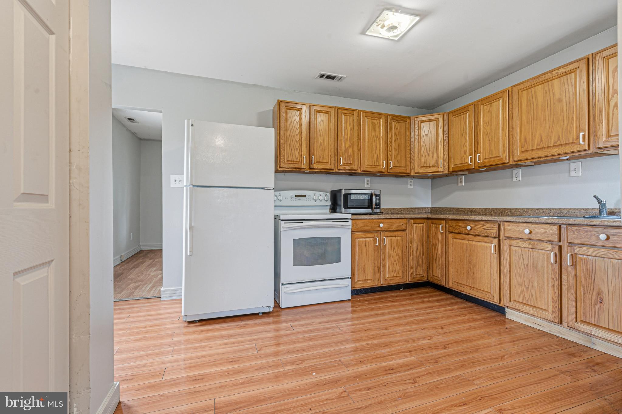 1903 Wills Road Baltimore, MD 21222 - Photo 14 of 21 Bright kitchen with warm wood cabinetry.
