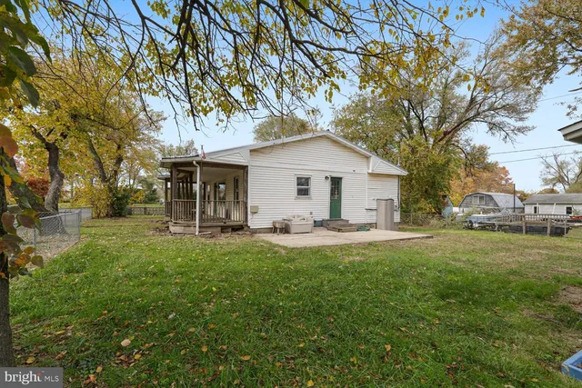 a front view of a house with yard porch and green space