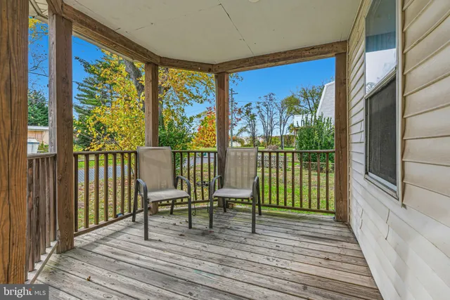 a view of a two chairs in the balcony