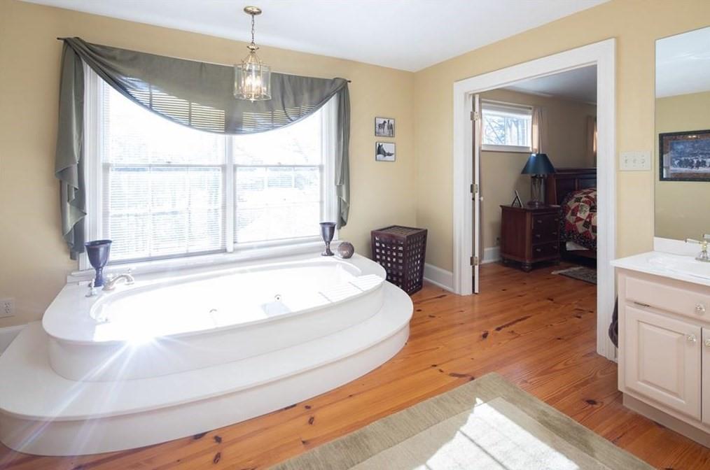 1249 Little Mountain Road Dawsonville, GA 30534 - Photo 15 of 40 a spacious bathroom with a tub and sink