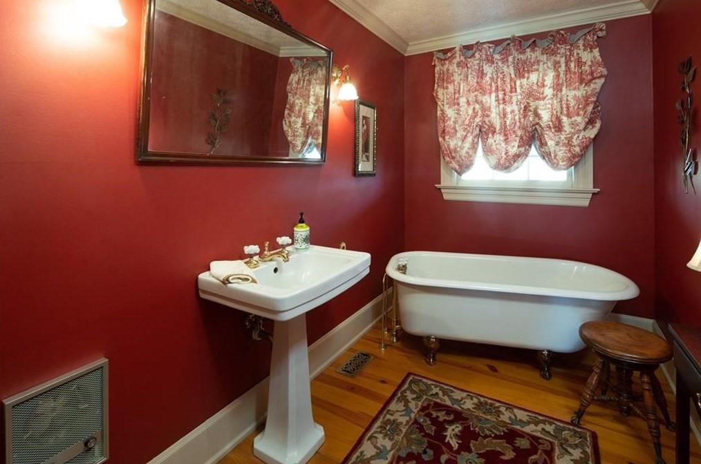 1249 Little Mountain Road Dawsonville, GA 30534 - Photo 18 of 40 a bathroom with a toilet a sink and mirror