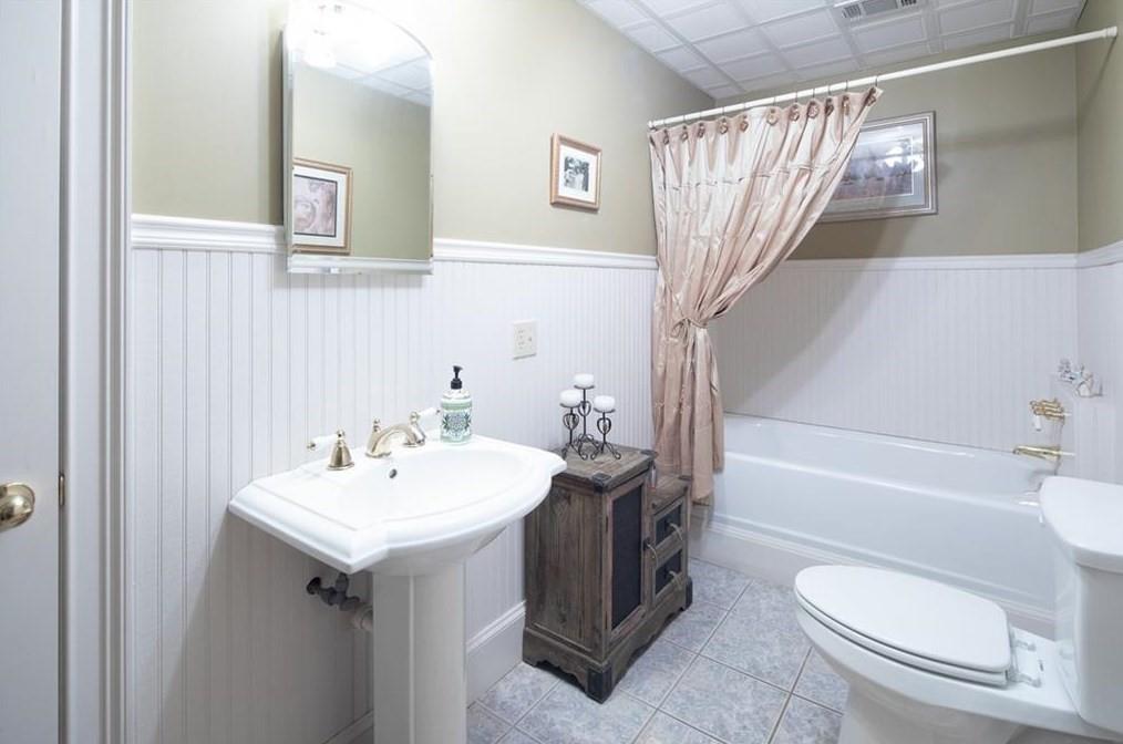 1249 Little Mountain Road Dawsonville, GA 30534 - Photo 21 of 40 a bathroom with a sink a toilet and a bathtub