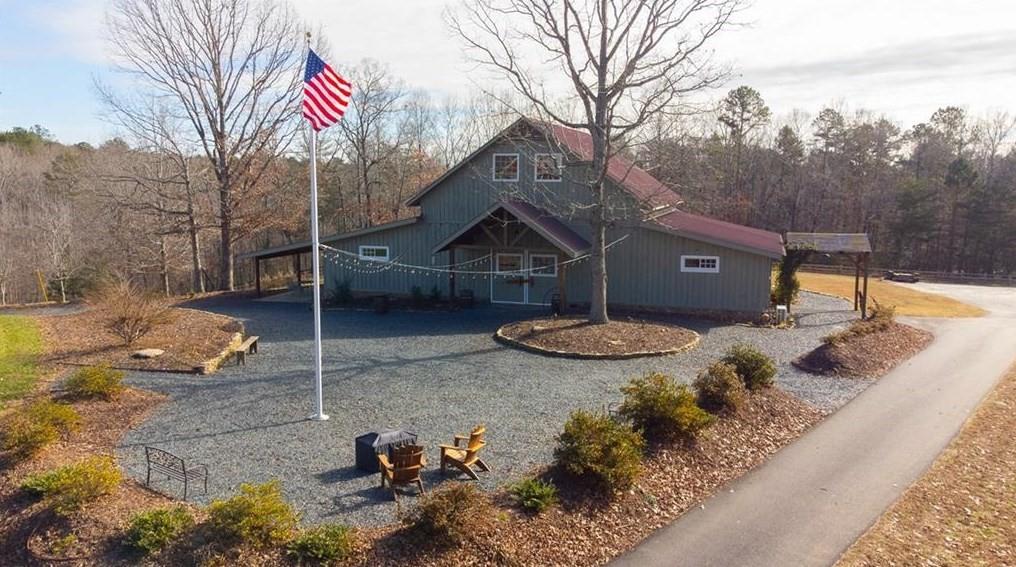 1249 Little Mountain Road Dawsonville, GA 30534 - Photo 26 of 40 a view of a house with backyard