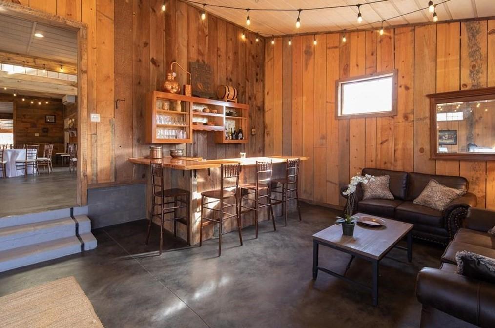 1249 Little Mountain Road Dawsonville, GA 30534 - Photo 28 of 40 a living room with patio furniture and a dining table