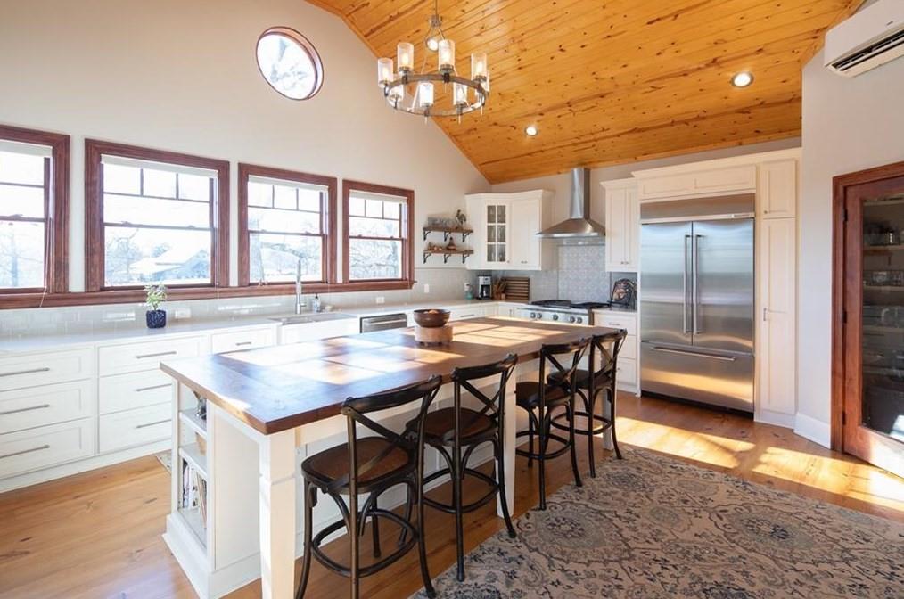 1249 Little Mountain Road Dawsonville, GA 30534 - Photo 3 of 40 a kitchen with a table and chairs