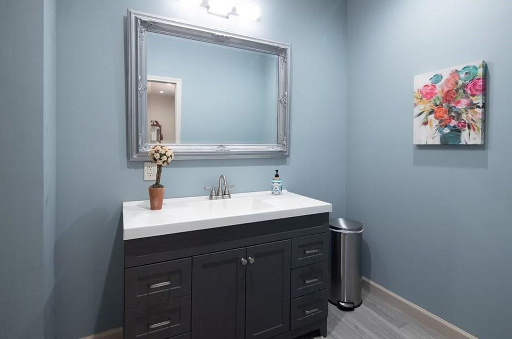 1249 Little Mountain Road Dawsonville, GA 30534 - Photo 32 of 40 a bathroom with a sink and a mirror