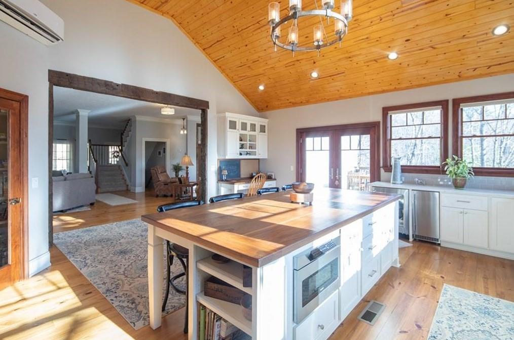 1249 Little Mountain Road Dawsonville, GA 30534 - Photo 4 of 40 a large kitchen with kitchen island a large island in it