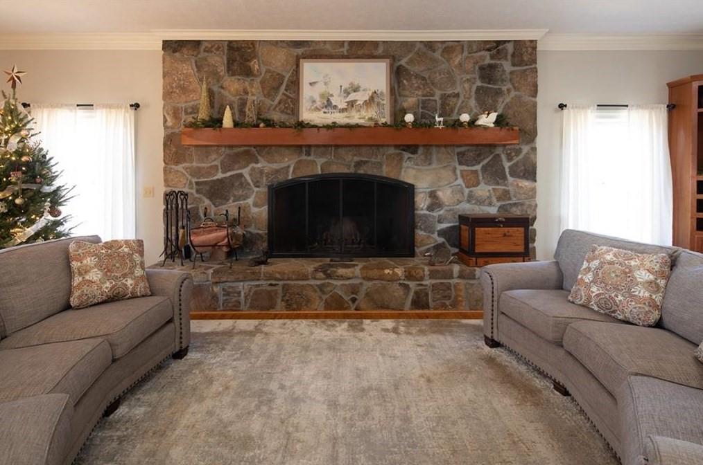 1249 Little Mountain Road Dawsonville, GA 30534 - Photo 5 of 40 a living room with furniture and a fireplace