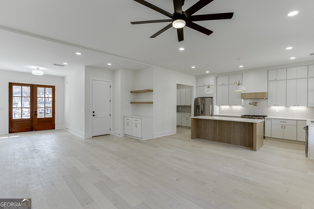 5422 Copper Crk Road Flowery Branch, GA 30542 - Photo 11 of 57 a view of an empty room with kitchen appliances and a window