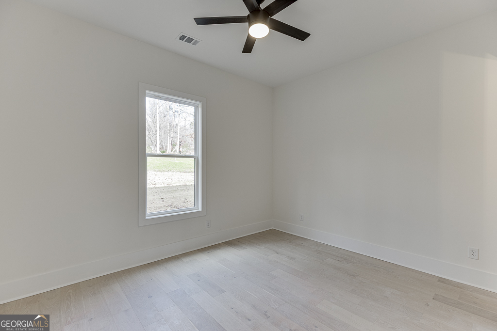 5422 Copper Crk Road Flowery Branch, GA 30542 - Photo 23 of 57 an empty room with a window