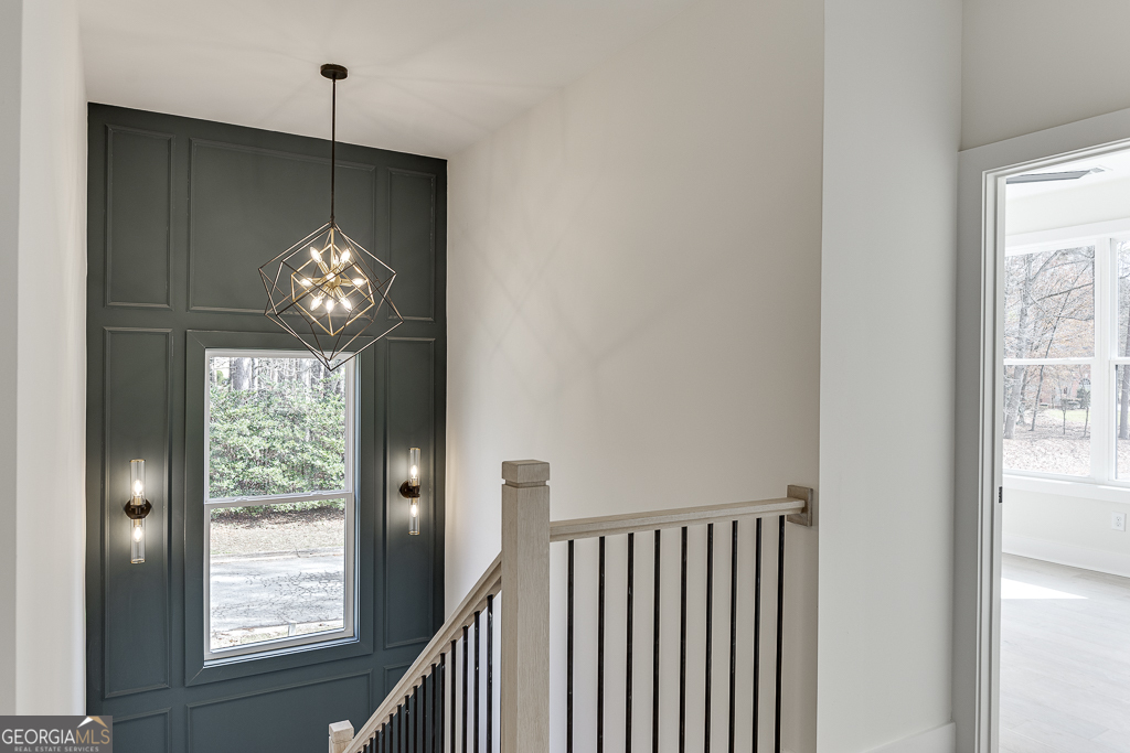 5422 Copper Crk Road Flowery Branch, GA 30542 - Photo 26 of 57 a view of a hallway to dining room and stairs